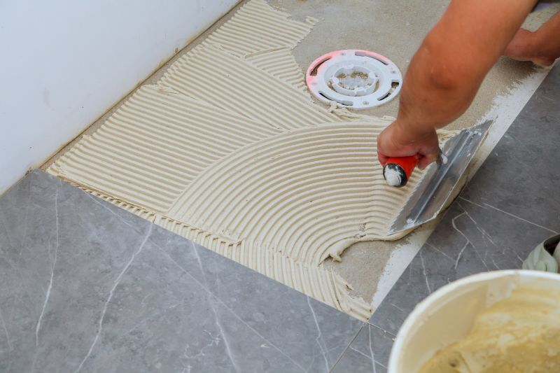 Tile professionals working on a bathroom